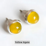 Pair of yellow agate stud earrings.