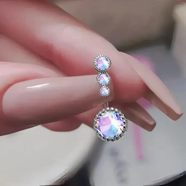 Iridescent jeweled belly ring.