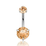 Belly button ring with two round, amber-colored gems.