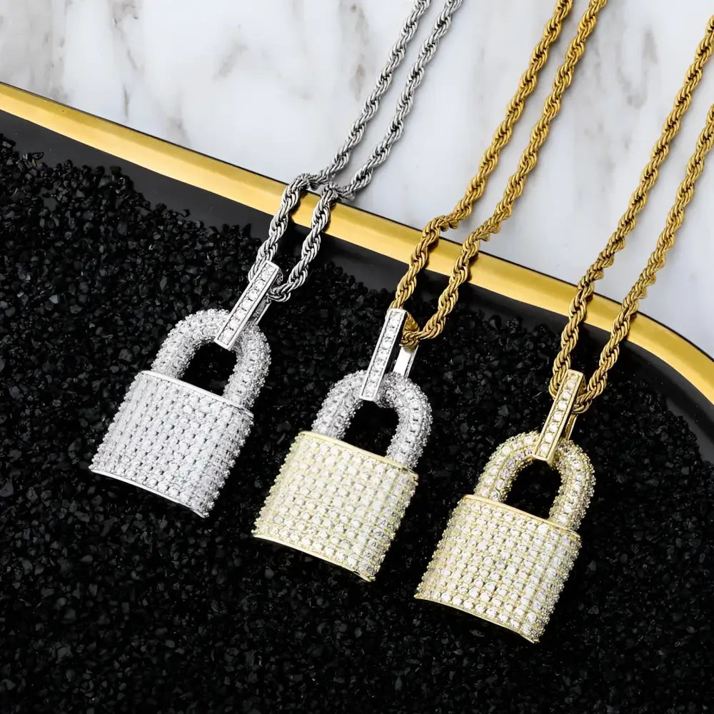 Three jeweled padlock necklaces.