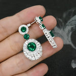 Emerald and diamond earrings.