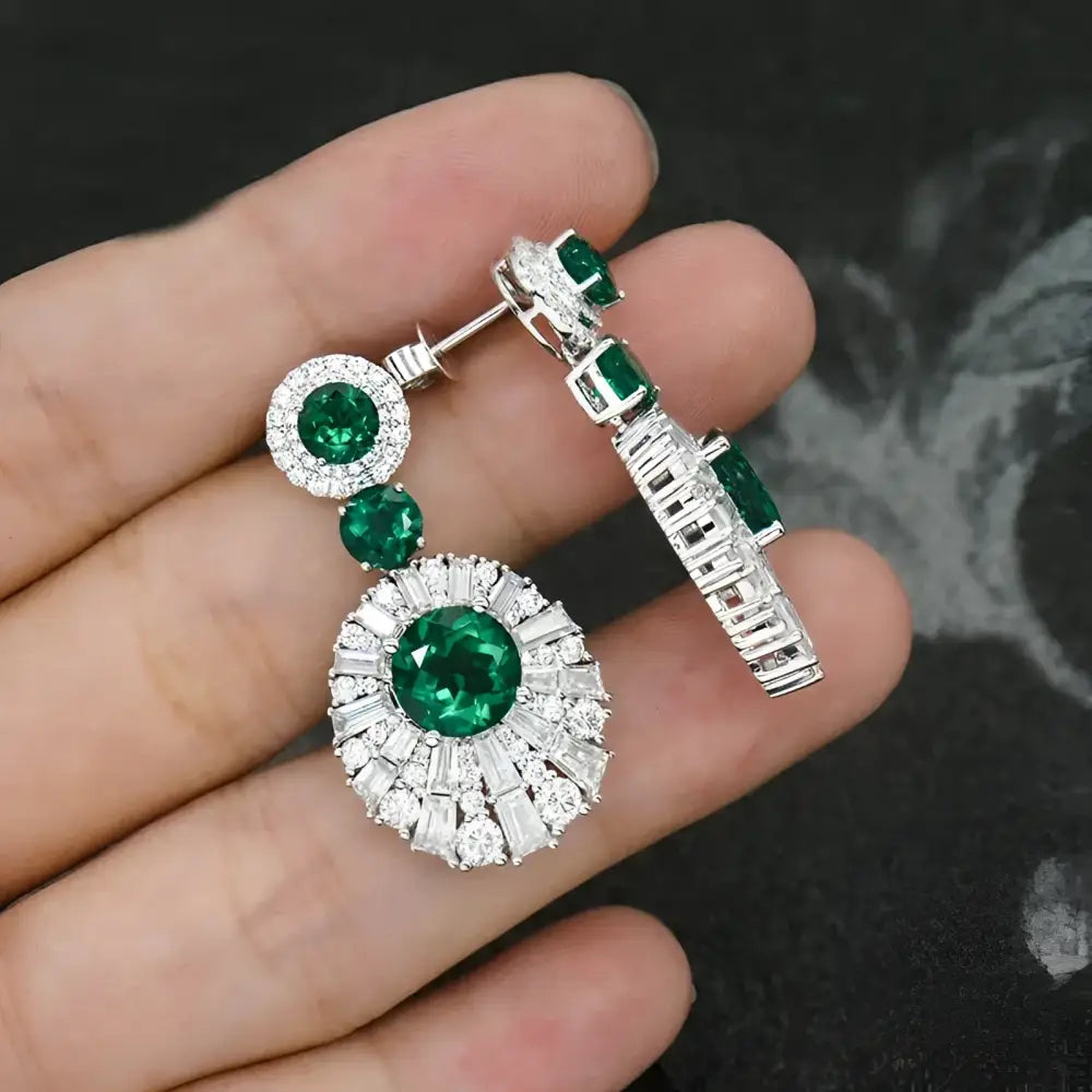 Emerald and diamond earrings.