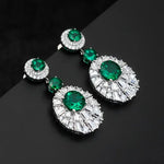 Emerald and diamond drop earrings.