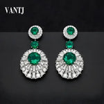 Emerald and diamond drop earrings.