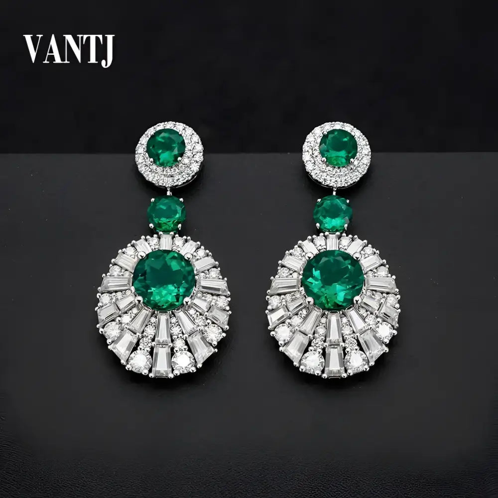 Emerald and diamond drop earrings.