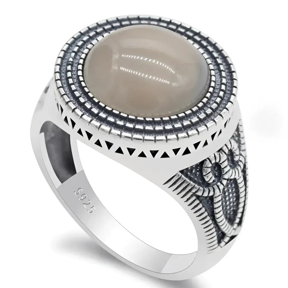 Silver ring with a round, gray stone.