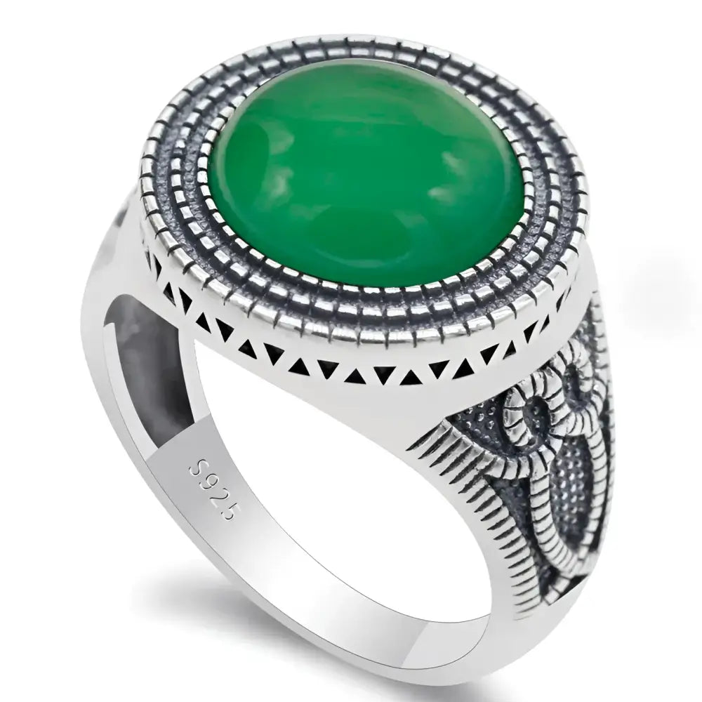Silver ring with green stone.