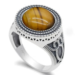 Silver ring with tiger’s eye stone.