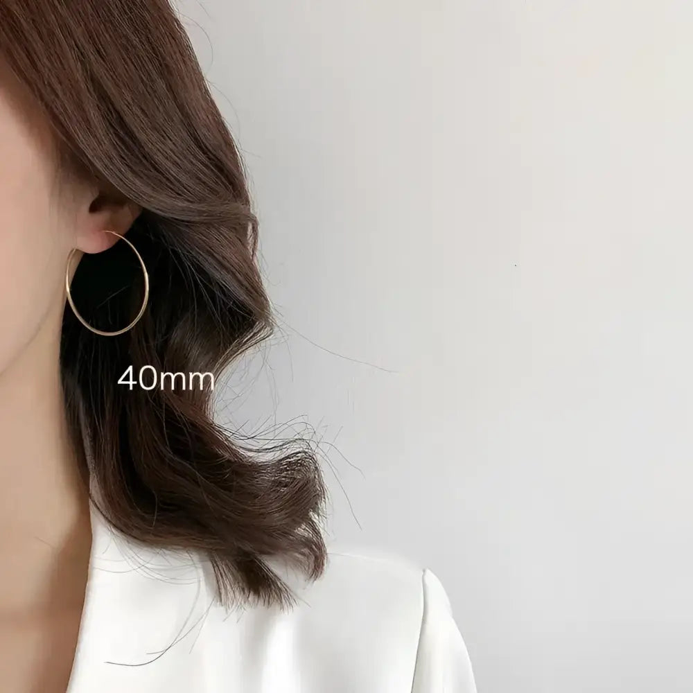 Gold hoop earring.
