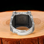 Ornate silver ring.