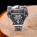 Silver skull ring.