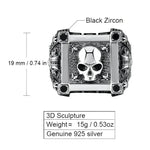 Silver skull ring with black zircon accents.
