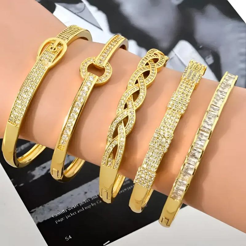 Gold-toned, jeweled bangle bracelets.
