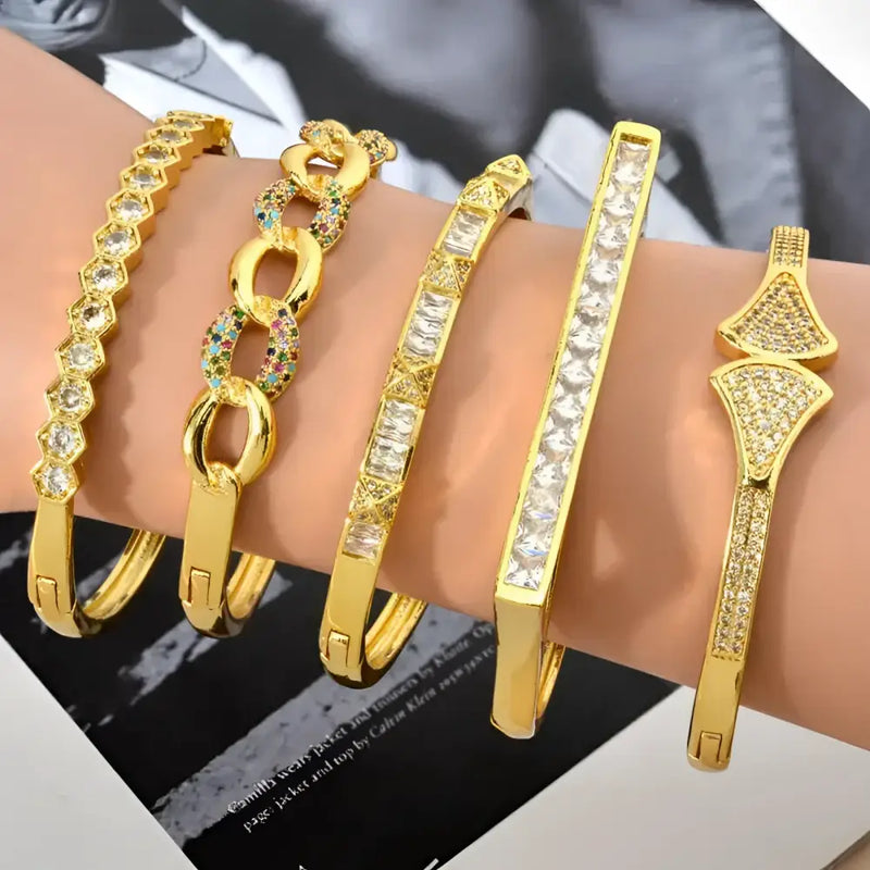Gold-toned, jeweled bangle bracelets.