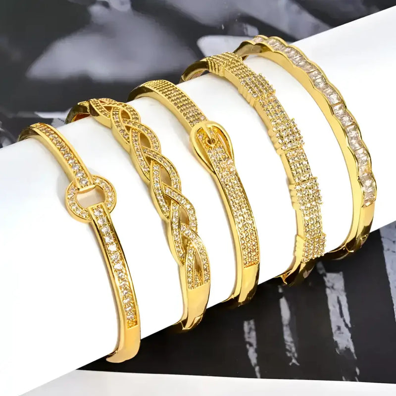 Gold-toned, jeweled bangle bracelets.