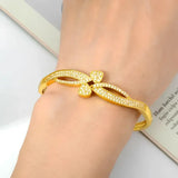 Gold-toned, rhinestone-studded bracelet.