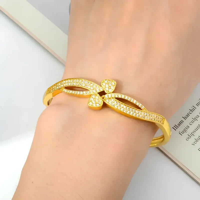 Gold-toned, rhinestone-studded bracelet.