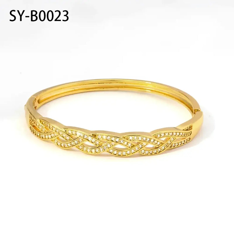 Gold-toned braided bangle with embedded crystals.