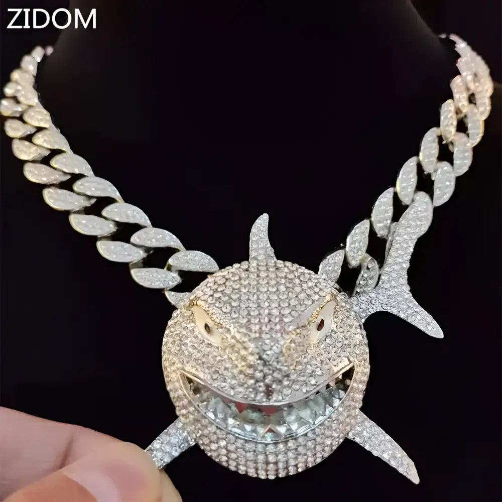 Rhinestone-covered shark pendant necklace.